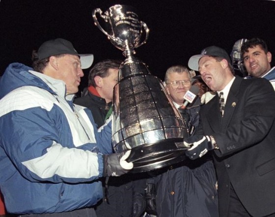 Baltimore Stallions' Don Matthews and Jim Speros hold the Grey Cup after Baltimore beat the Calgary Stampeders 37-20 during the 83rd Grey Cup in Regina on Nov. 19, 1995. THE CANADIAN PRESS/Joe Bryksa