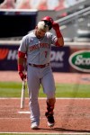 Cincinnati Reds' Eugenio Suarez reacts after striking out to end the sixth inning against the Atlanta Braves in Game 2 of a National League wild-card baseball series, Thursday, Oct. 1, 2020, in Atlanta. (AP Photo/John Bazemore)
