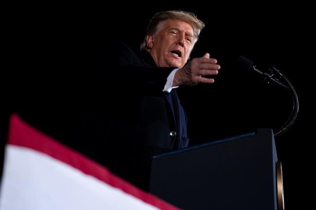 President Donald Trump speaks during a campaign rally for Sen. Kelly Loeffler, R-Ga., and David Perdue, at Dalton Regional Airport, Monday, Jan. 4, 2021, in Dalton, Ga. (AP Photo/Evan Vucci)