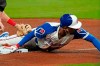 Atlanta Braves' Cristian Pache (25) advances to third base on a Ronald Acuna Jr. fly ball in the fifth inning of a baseball game against the Philadelphia Phillies, Saturday, April 10, 2021, in Atlanta. (AP Photo/John Bazemore)