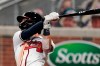 Atlanta Braves' Dansby Swanson follows through on a game-ending, two-run home run in the ninth inning of the team's baseball game against the Washington Nationals on Monday, Aug. 17, 2020, in Atlanta. The Braves won 7-6. (AP Photo/John Bazemore)