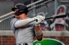 New York Yankees' Aaron Judge follows through on a single during the fourth inning of the second game of the team's baseball doubleheader against the Atlanta Braves on Wednesday, Aug. 26, 2020, in Atlanta. (AP Photo/John Bazemore)
