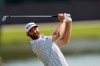 Dustin Johnson hits from the fairway on the 8th hole during the third round of the Tour Championship golf tournament at East Lake Golf Club in Atlanta, Sunday, Sept. 6, 2020. (AP Photo/John Bazemore)