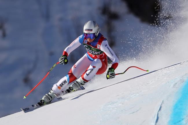 Switzerland's Corinne Suter speeds down the course during an alpine ski, women's World Cup downhill in St. Anton, Austria, Saturday, Jan. 9, 2021. (AP Photo/Marco Trovati)