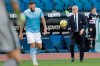 Sampdoria coach Claudio Ranieri holds the ball during the Italian Serie A soccer match between Lazio and Sampdoria at Rome's Olympic stadium, Saturday, Feb. 20, 2021. (AP Photo/Gregorio Borgia)