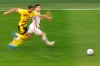 Dortmund's Manuel Akanji, left, and Frankfurt's Luka Jovic challenge for the ball during the German Bundesliga soccer match between Borussia Dortmund and Eintracht Frankfurt in Dortmund, Germany, Saturday, April 3, 2021. (Lars Baron/Pool via AP)