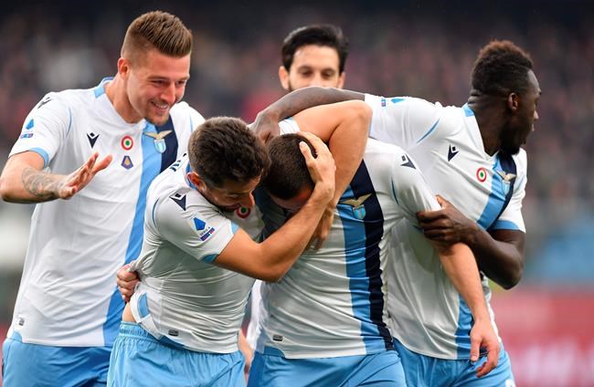 Lazio's Adam Marusic, second right, celebrates with teammates after scoring his side's opening goal during the Serie A soccer match between Genoa and Lazio, at the Luigi Ferrari stadium in Genoa, Italy, Sunday, Feb. 23, 2020. (Tano Pecoraro/Lapresse via AP)