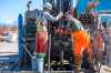 MIKAELA MACKENZIE / WINNIPEG FREE PRESS
Adam Zurbyk (left) and Dylan Goertzen drill boreholes at The Forks Wednesday in preparation for what will become a district geothermal energy system at the Railside at The Forks development.