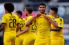 FILE - In this Sunday, May 31, 2020 file photo Achraf Hakimi Mouh of Borussia Dortmund celebrates scoring his teams fourth goal of the game with 'Justice for George Floyd' written on his under shirt during the German Bundesliga soccer match between SC Paderborn 07 and Borussia Dortmund at Benteler Arena in Paderborn, Germany. Since George Floyd's death in the U.S. state of Minnesota last week, his face has been painted on walls from Nairobi, Kenya to Idlib, Syria. Floyd's name has been inked on the shirts of soccer players and chanted by crowds from London and Cape Town to Tel Aviv and Sydney. (Lars Baron/Pool via AP, File)