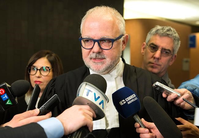 Crown Prosecutor Richard Roy speaks to reporters in Montreal, Wednesday, December 18, 2019, after SNC-Lavalin pleaded guilty in their ongoing fraud case. SNC-Lavalin Group Inc. has settled criminal charges related to work the company did in Libya Wednesday, with its construction division pleading guilty to a single count of fraud and bringing the company a step closer to closing a long-standing scandal that tarnished its reputation and ensnared the highest office of the Canadian government. THE CANADIAN PRESS/Graham Hughes