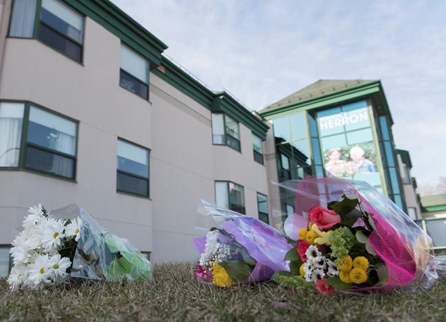 Flowers are shown outside Maison Herron, a long term care home in the Montreal suburb of Dorval, Sunday, April 12, 2020, as COVID-19 cases rise in Canada and around the world. THE CANADIAN PRESS/Graham Hughes