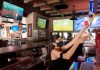 A server pulls a pint of beer at Station Sports bar in Montreal, Saturday, July 25, 2020, as the COVID-19 pandemic continues in Canada and around the world. THE CANADIAN PRESS/Graham Hughes