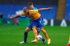 Crystal Palace's James McCarthy, rear fights for the ball with Everton's Richarlison during the English Premier League soccer match between Crystal Palace and Everton, at Selhurst Park, London, Saturday, Sept. 26, 2020. (Clive Rose/Pool via AP)