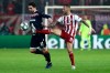 Olympiakos' Guilherme, right, fights for the ball with Red Star's Tomane during the Champions League group B soccer match between Olympiakos and Red Star at the Georgios Karaiskakis stadium in Piraeus port, near Athens, Wednesday, Dec. 11, 2019. (AP Photo/Petros Giannakouris)