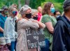 Protesters gather in Halifax's Victoria Park to demand a public inquiry into the deadly mass shootings that claimed 22 lives in Nova Scotia last April, on Monday, July 27, 2020. The federal and provincial governments have announced a review of the massacre that will not be able to compel witnesses or testimony, no power to subpoena evidence and won't be able to make binding recommendations to the government. THE CANADIAN PRESS/Andrew Vaughan