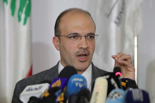 Lebanese Health Minister Hamad Hassan speaks during a news conference, in Beirut, Lebanon, Friday, Feb. 21, 2020. Hassan on Friday reported the Mediterranean country's first case of the new virus. He said the patient was a 45-year-old woman who arrived on Thursday on a flight from the Iranian city of Qom. He said the woman was in
