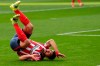 Atletico Madrid's Luis Suarez grimaces fallen on the ground during the Spanish La Liga soccer match between Atletico Madrid and Levante at the Wanda Metropolitano stadium in Madrid, Spain, Saturday, Feb. 20, 2021. (AP Photo/Manu Fernandez)