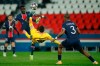Barcelona's Lionel Messi, center, attempts an overhead kick at goal in front of PSG's Idrissa Gueye, left, and PSG's Presnel Kimpembe during the Champions League, round of 16, second leg soccer match between Paris Saint-Germain and FC Barcelona at the Parc des Princes stadium in Paris, Wednesday, March 10, 2021. (AP Photo/Christophe Ena)