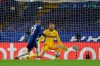 Atletico Madrid's goalkeeper Jan Oblak, right, fails to save the ball as Chelsea's Hakim Ziyech scores his side's opening goal during the Champions League, round of 16, second leg soccer match between Chelsea and Atletico Madrid at the Stamford Bridge stadium, London, Wednesday, March 17, 2021. (AP Photo/Matt Dunham)