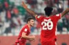Bayern's Benjamin Pavard, left, celebrates after scoring his side's opening goal during the Club World Cup final soccer match between FC Bayern Munich and Tigres at the Education City stadium in Al Rayyan, Qatar, Thursday, Feb. 11, 2021. (AP Photo)