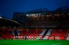 Manchester United and Arsenal players take part in a minute of silence as a soldier at left lays a wreath during the English Premier League soccer match between Manchester United and Arsenal at the Old Trafford stadium in Manchester, England, Sunday, Nov. 1, 2020. (Shaun Botterill/Pool via AP)