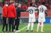 Bayern's head coach Hans-Dieter Flick, center, speaks with Bayern's David Alaba during the Club World Cup semifinal soccer match between FC Bayern Munich and Al Ahly at Al Rayyan stadium in Al Rayyan, Qatar, Monday, Feb. 8, 2021. (AP Photo/Hussein Sayed)