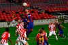 Barcelona's Ronald Araujo, top, heads the ball past Athletic Bilbao's Yeray Alvarez during the Spanish La Liga soccer match between FC Barcelona and Athletic Bilbao at the Camp Nou stadium in Barcelona, Spain, Sunday, Jan. 31, 2021. (AP Photo/Joan Monfort)