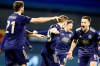 Dinamo Zagreb's Mislav Orsic, center, celebrates with his teammates after scoring his side's second goal during the Europa League round of 16 second leg soccer match between Dinamo Zagreb and Tottenham Hotspur at the Maksimir stadium in Zagreb, Croatia, March 18, 2021. (AP Photo/Darko Bandic)