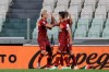 Roma's Diego Perotti, right, celebrates after scoring his side's third goal with his teammate Roma's Nicolo Zaniolo during a Serie A soccer match between Juventus and Roma, at the Allianz stadium in Turin, Italy, Saturday, Aug.1, 2020. (AP Photo/Luca Bruno)