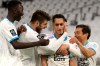 Marseille's Saif-Eddine Khaoui, second right, celebrates after scoring his side's third goal during the French League One soccer match between Olympique de Marseille and Nice at the Velodrome stadium in Marseille, southern France, Wednesday, Feb. 17, 2021. (AP Photo/Daniel Cole)