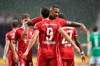 Bayern's Robert Lewandowski, foreground, celebrates with his teammate Bayern's Jerome Boateng after scoring his side's opening goal during the German Bundesliga soccer match between Werder Bremen and Bayern Munich in Bremen, Germany, Tuesday, June 16, 2020. Because of the coronavirus outbreak all soccer matches of the German Bundesliga take place without spectators. (AP Photo/Martin Meissner, Pool)