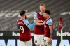 West Ham's Jesse Lingard, right, celebrates with his teammates after scoring his side's opening goal during the English Premier League soccer match between West Ham United and Leeds United at the London Stadium in London, England, Monday, March 8, 2021. (Ian Walton, Pool)