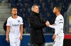 Frankfurt's head coach Adi Huetter, center, congratulates Frankfurt's Djibril Sow end of the Europa League round of 32 second leg soccer match between FC Red Bull Salzburg and Eintracht Frankfurt at the Red Bull Arena in Salzburg, Austria, Friday, Feb. 28, 2020. (AP Photo/Kerstin Joensson)