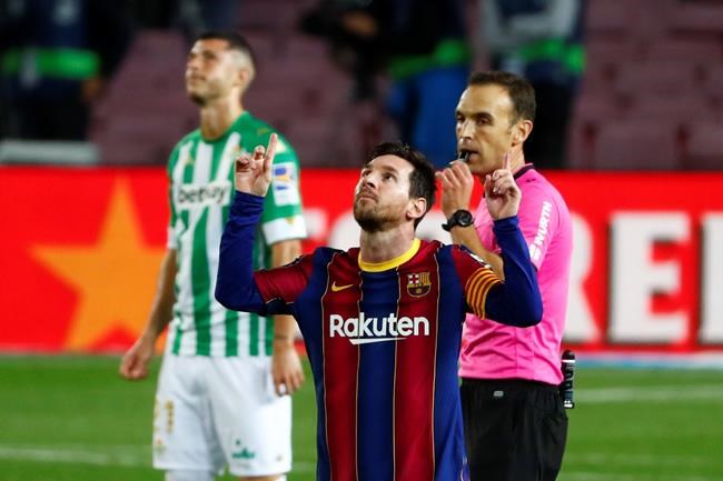 Barcelona's Lionel Messi celebrates after scoring his side's fourth goal during the Spanish La Liga soccer match between FC Barcelona and Betis at the Camp Nou stadium in Barcelona, Spain, Saturday, Nov. 7, 2020. (AP Photo/Joan Monfort)