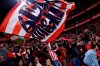 Athletic Bilbao fans celebrate at the end of the Spanish Copa del Rey, quarter final, soccer match between Athletic Bilbao and Barcelona at San Mames stadium in Bilbao, Spain, Thursday, Feb. 6, 2020. Athletic Bilbao won 1-0. (AP Photo/Alvaro Barrientos)