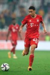 Bayern's Jamal Musiala runs with the ball during the Club World Cup final soccer match between FC Bayern Munich and Tigres at the Education City stadium in Al Rayyan, Qatar, Thursday, Feb. 11, 2021. (AP Photo)