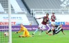 Newcastle's Dwight Gayle, right, scores his side's opening goal during the English Premier League soccer match between Newcastle United and Aston Villa at St James' Park stadium in NewCastle, England, Wednesday, June 24, 2020. (Laurence Griffiths/Pool via AP)