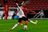 Turkey's Kenan Karaman, background, attempts a shot at goal in front of Germany's Robin Koch to scores his side's third goal during the international friendly soccer match between Germany and Turkey in Cologne, Germany, Wednesday, Oct. 7, 2020. (AP Photo/Martin Meissner)