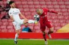 Real Madrid's Marco Asensio, fights for the ball with Liverpool's Fabinho during a Champions League quarter final second leg soccer match between Liverpool and Real Madrid at Anfield stadium in Liverpool, England, Wednesday, April 14, 2021. (AP Photo/Jon Super)