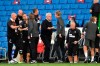Newcastle's head coach Steve Bruce, center, cheers Brighton's head coach Graham Potter end of the English Premier League soccer match between Brighton and Newcastle United at the American Express Community Stadium in Brighton, England, Monday, July 20, 2020. (Glyn Kirk/Pool via AP)
