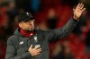 Liverpool's manager Jurgen Klopp applauds fans at the end of the second leg, round of 16, Champions League soccer match between Liverpool and Atletico Madrid at Anfield stadium in Liverpool, England, Wednesday, March 11, 2020. (AP Photo/Jon Super)