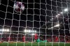 Liverpool's goalkeeper Adrian, center bottom, fails to save the ball as Atletico Madrid's Marcos Llorente scores his side's second goal during a second leg, round of 16, Champions League soccer match between Liverpool and Atletico Madrid at Anfield stadium in Liverpool, England, Wednesday, March 11, 2020. (AP Photo/Jon Super)