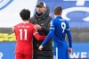 Liverpool's manager Jurgen Klopp, center, comforts Liverpool's Mohamed Salah end of the English Premier League soccer match between Leicester City and Liverpool at the King Power Stadium in Leicester, England, Saturday, Feb. 13, 2021. (Michael Regan/Pool Photo via AP)
