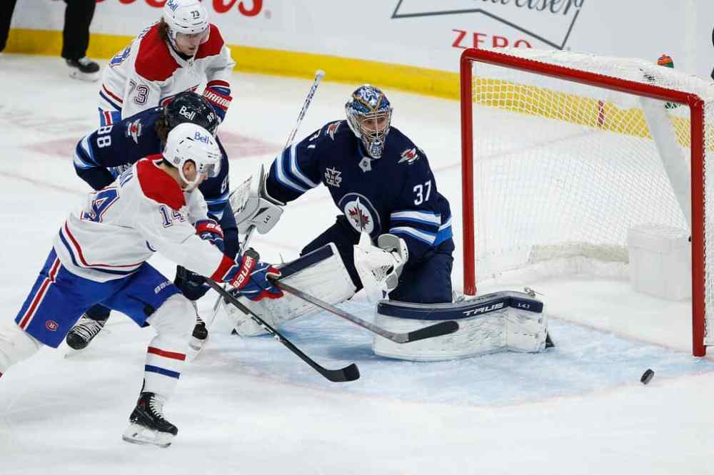 A heroic performance by Winnipeg Jets goaltender Connor Hellebuyck on Saturday helped his team defeat the Montreal Canadiens even though the Jets were badly outplayed. THE CANADIAN PRESS/John Woods