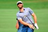 Dustin Johnson watches his chip onto the ninth green during the third round of the Tournament of Champions golf event, Saturday, Jan. 9, 2021, at Kapalua Plantation Course in Kapalua, Hawaii. (Matthew Thayer/The Maui News via AP)
