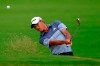Collin Morikawa chips onto the 10th green during the first round of the Sony Open PGA Tour golf event, Thursday, Jan. 9, 2020, at Waialae Country Club in Honolulu. (AP Photo/Matt York)