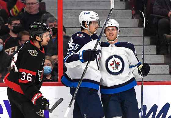 CPWinnipeg Jets left wing Nikolaj Ehlers (27) celebrates his goal with centre Mark Scheifele (55) as Ottawa Senators centre Colin White (36) skates by, during the first period. (Justin Tang / The Canadian Press)