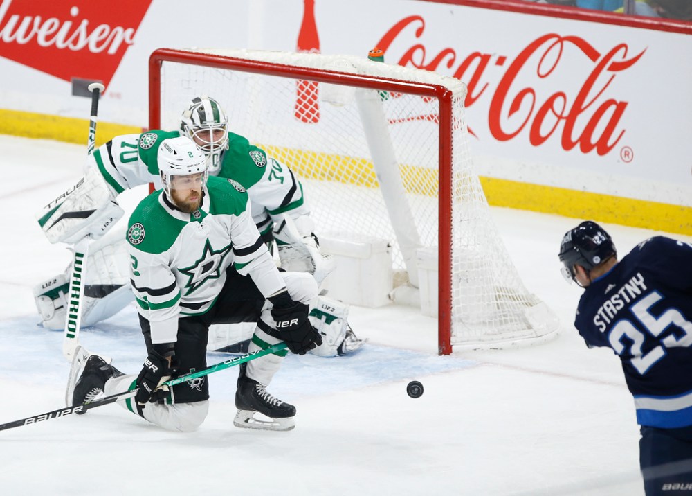 Winnipeg Jets' Paul Stastny scores on Dallas Stars goaltender Braden Holtby as Jani Hakanpaa defends during the second period. THE CANADIAN PRESS/John Woods