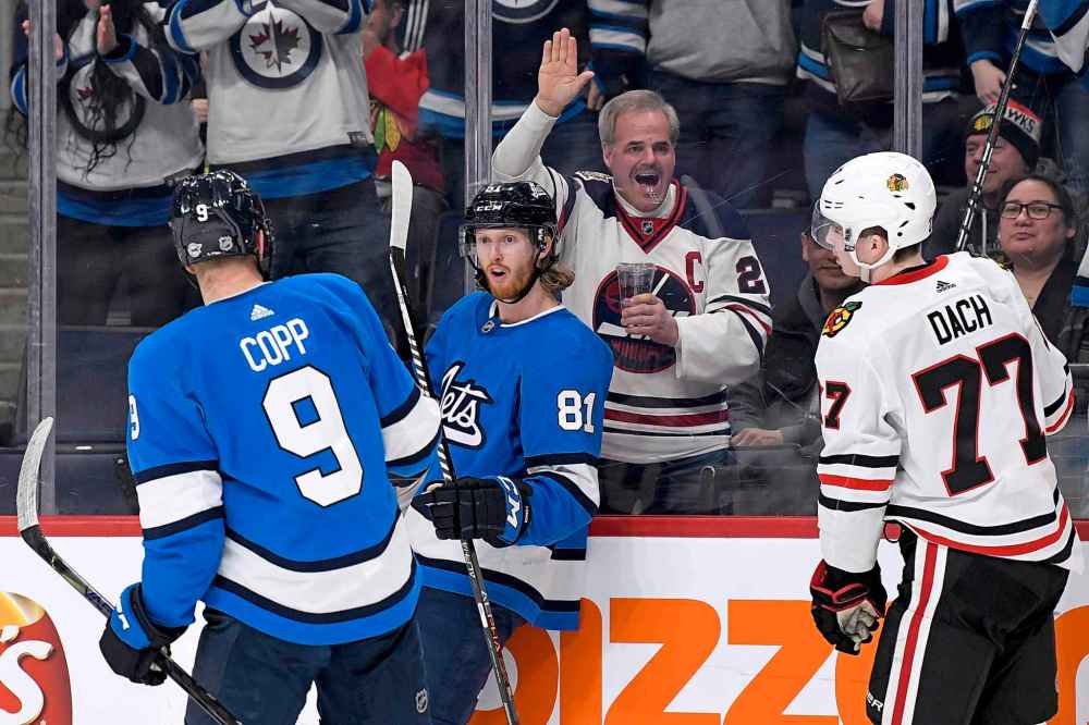 Winnipeg Jets' Kyle Connor (81) celebrates his short-handed goal against the Chicago Blackhawks with Andrew Copp (9) during second period NHL action in Winnipeg on Sunday, Feb. 9, 2020. (Fred Greenslade / The Canadian Press)