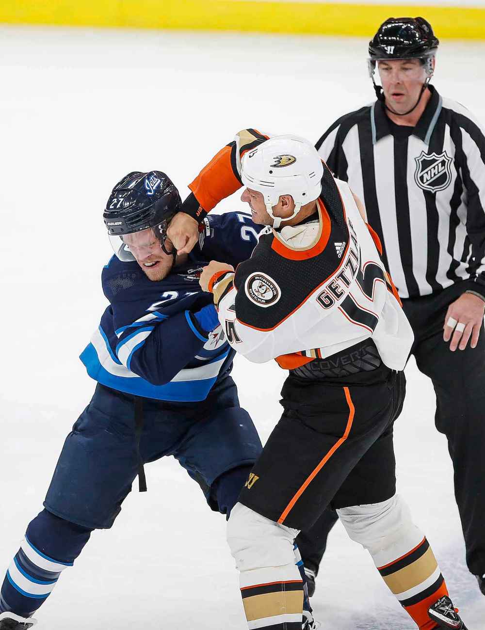 Winnipeg Jets’ Nikolaj Ehlers (27) and Anaheim Ducks' Ryan Getzlaf (15) fight during the first period. (John Woods / Winnipeg Free Press)